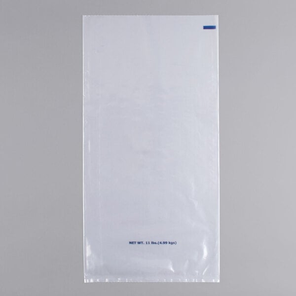 A white plastic bag with a blue label and blue text containing a rectangular object.