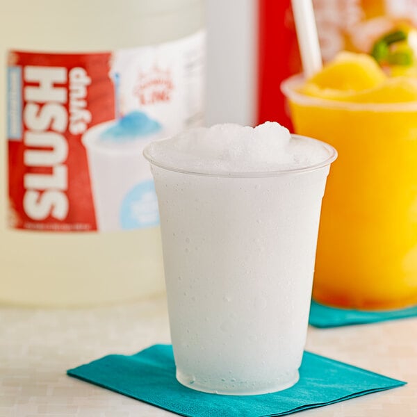 A plastic cup filled with white Carnival King slushy drink.