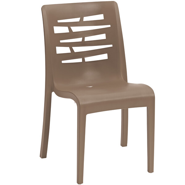 A Grosfillex taupe resin outdoor restaurant chair with holes in the back.