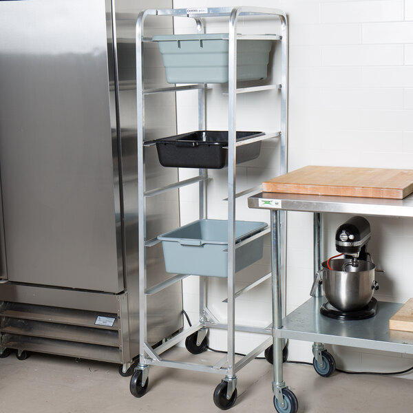 A Channel stainless steel lug rack on a metal shelf in a kitchen.