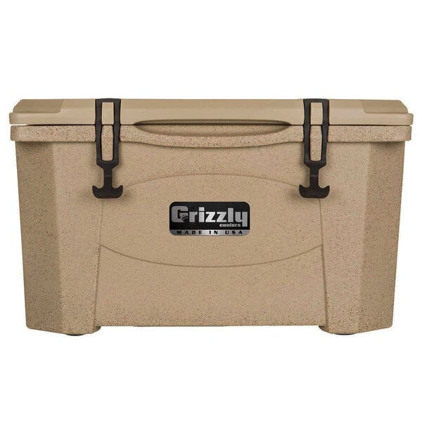 A Grizzly cooler in tan with black handles and a lid.