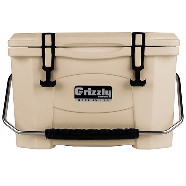 A tan Grizzly Cooler box with black handles.