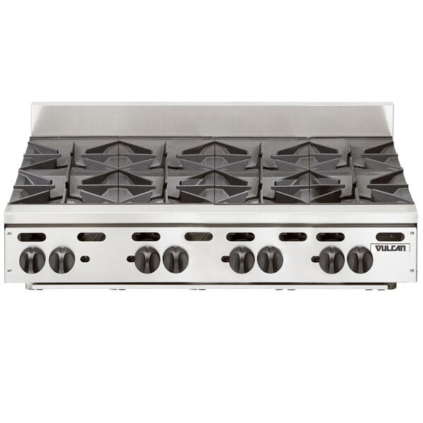 A stainless steel Vulcan countertop gas range with eight burners.