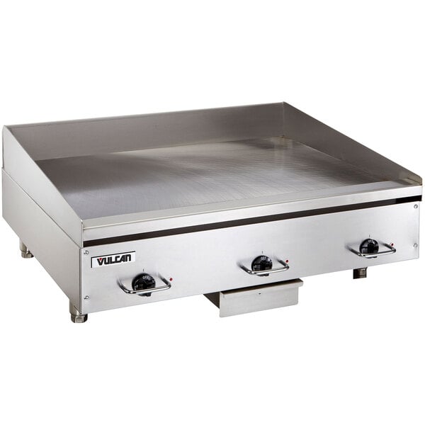 A large stainless steel Vulcan countertop electric griddle.