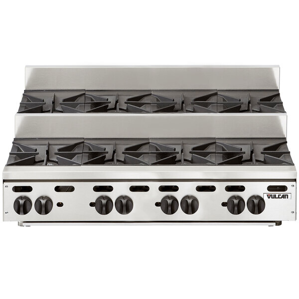 A stainless steel Vulcan countertop range with eight burners.