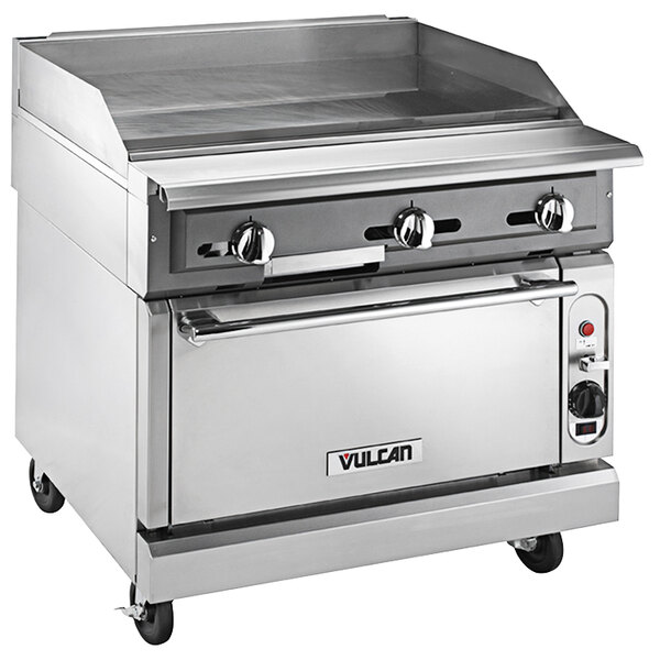 A Vulcan stainless steel gas range with griddle top on wheels.
