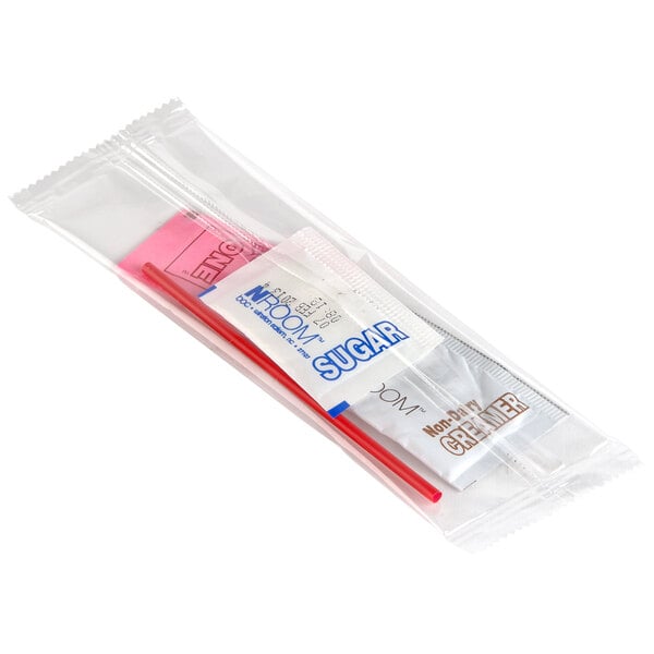 A clear plastic bag with a sugar packet and creamer stick.