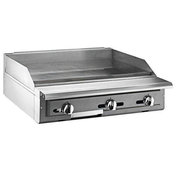 A Vulcan stainless steel modular range with a griddle top.