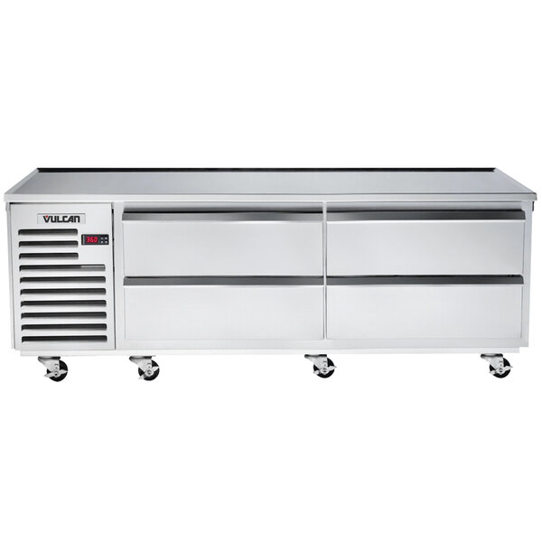 A stainless steel Vulcan commercial chef base with four drawers and wheels.