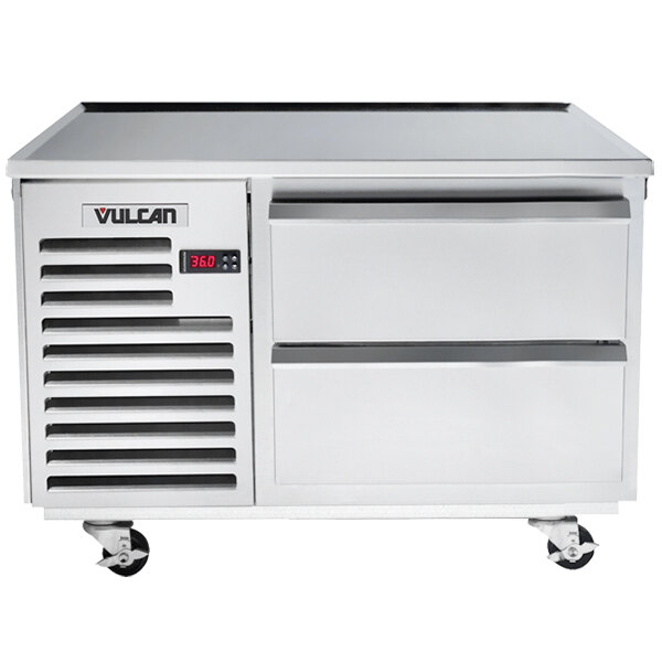 A white metal Vulcan chef base with drawers.
