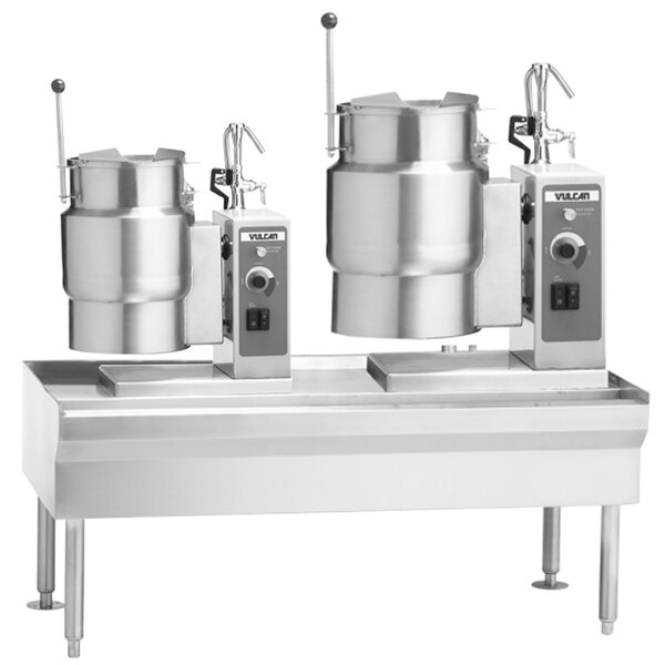 The control panel of a Vulcan table with two electric tilting kettles.