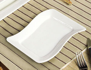 A CAC Soho ivory rectangular stoneware platter on a table.