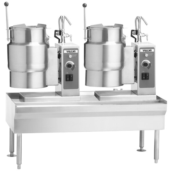 A Vulcan metal table with two electric steam kettles on it.