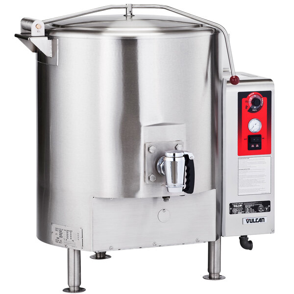 A large stainless steel Vulcan stationary steam jacketed electric kettle with a red handle.