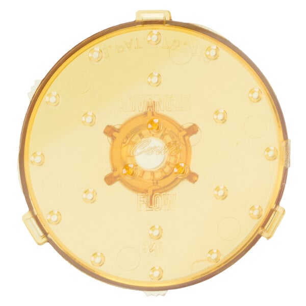 A yellow circular object with holes in it.