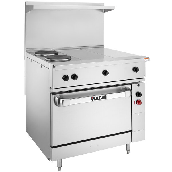 A large stainless steel Vulcan commercial electric range with 2 French plates and 2 hot tops.