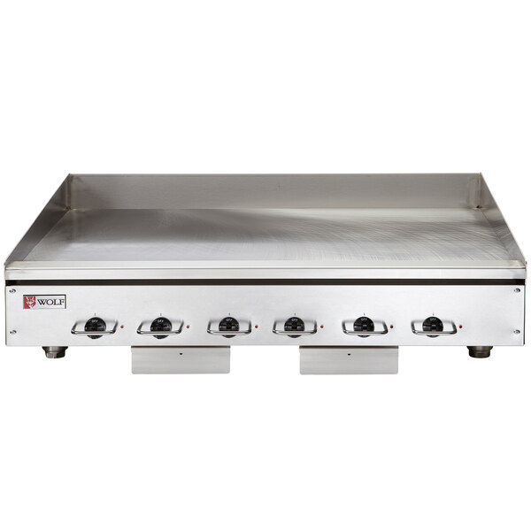 A Wolf stainless steel electric countertop griddle with thermostatic controls.