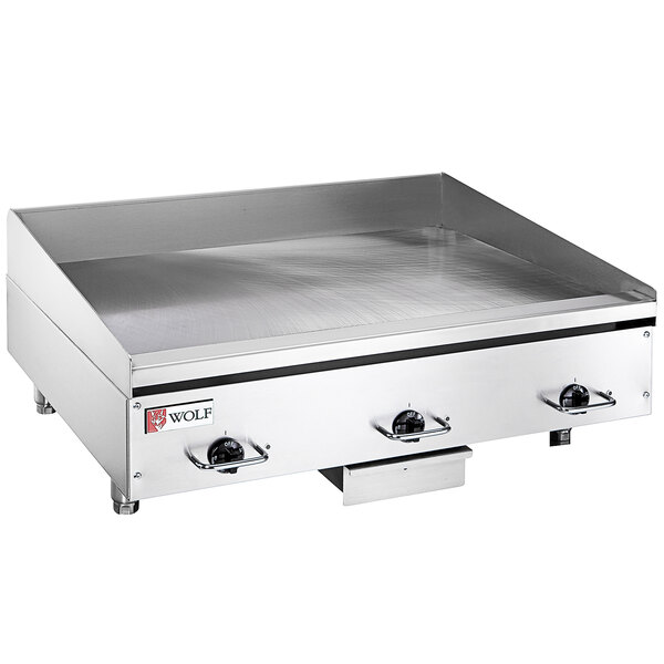 A large stainless steel Wolf countertop electric griddle.