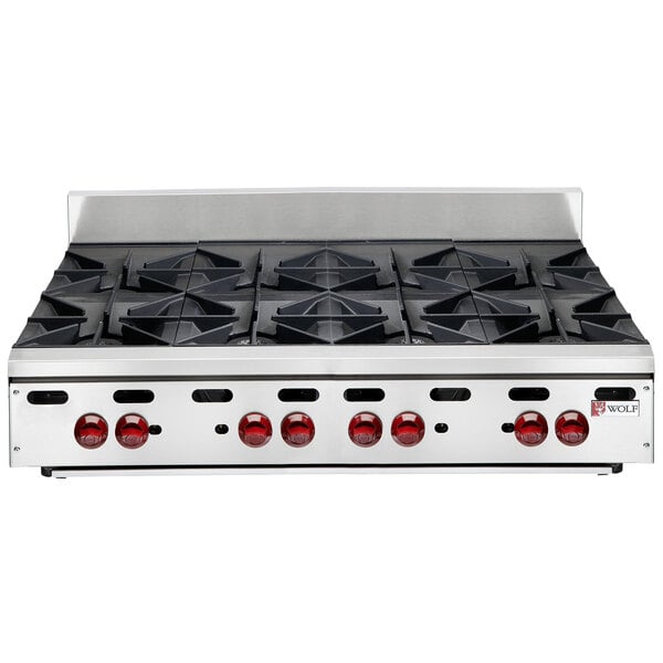 A Wolf stainless steel countertop gas range with eight burners.