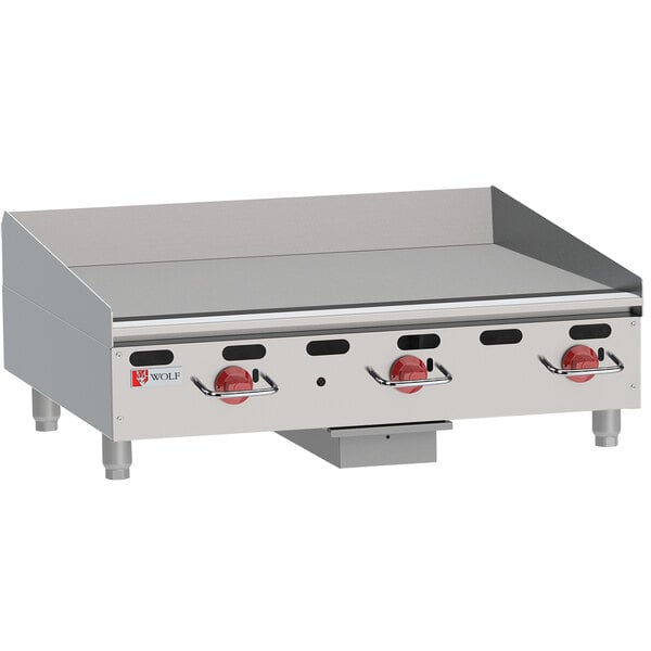 A Wolf liquid propane heavy-duty gas countertop griddle with manual controls.