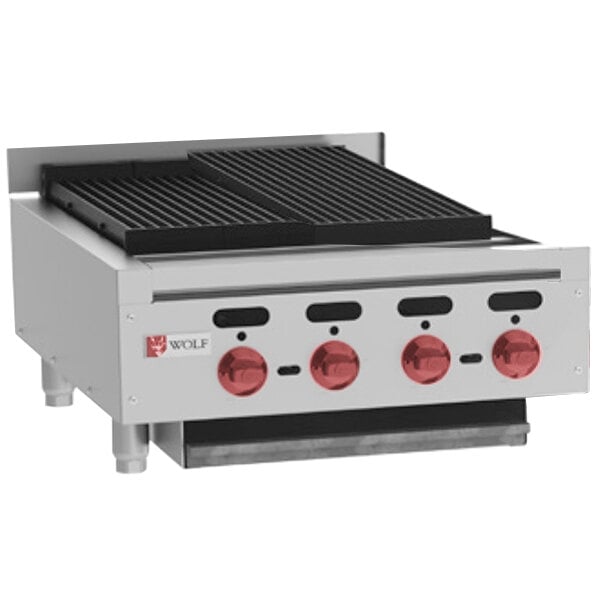 A Wolf by Vulcan stainless steel countertop charbroiler with red knobs.