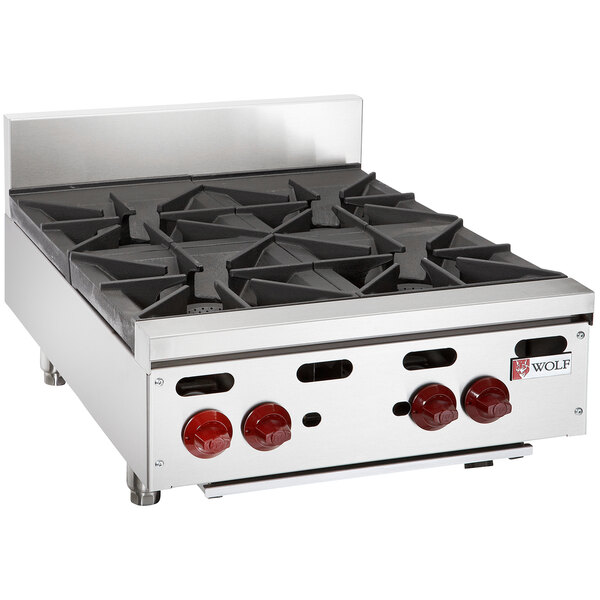 A Wolf stainless steel liquid propane countertop range with four burners.
