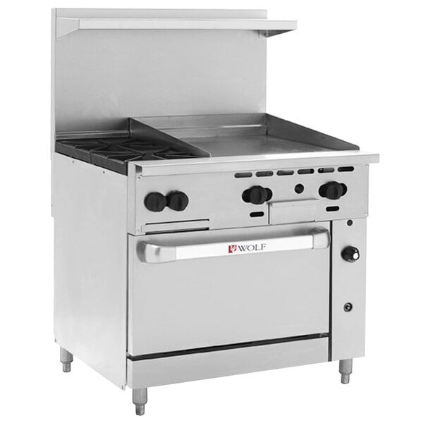 A large stainless steel Wolf commercial range with two burners, a griddle, and a convection oven.