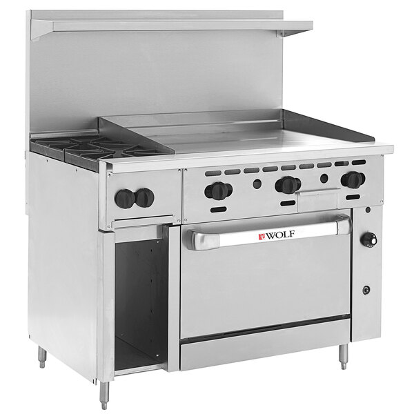 A large stainless steel Wolf commercial gas range with 2 burners, right side griddle, and convection oven.
