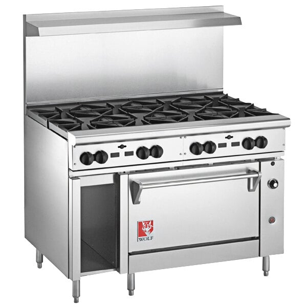 A large stainless steel Wolf commercial gas range on a counter.