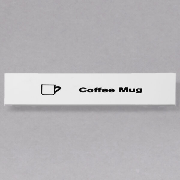 A white rectangular sign with a black coffee mug and text that says "Coffee"