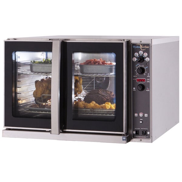 A Blodgett electric commercial convection oven with trays of food inside.