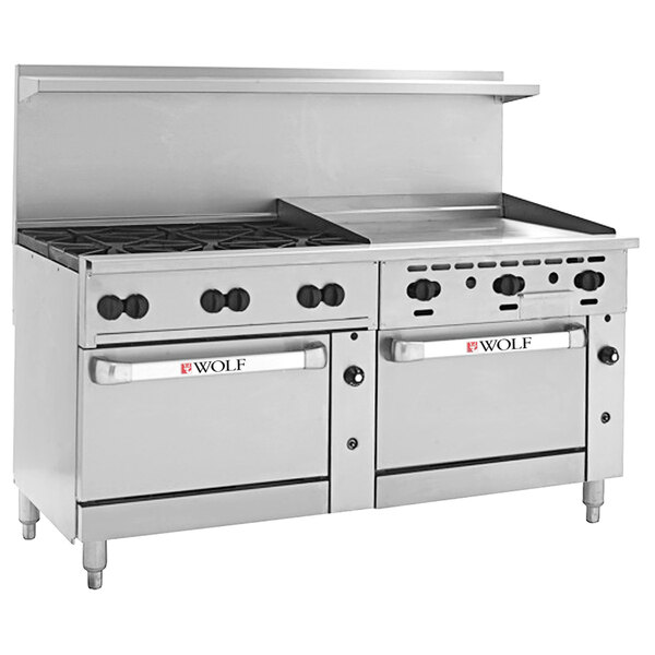 A Wolf commercial stainless steel range with 6 burners, a griddle, and two ovens.