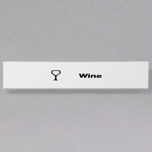 A white rectangular Cambro wine glass ID clip with black text on a wine glass.