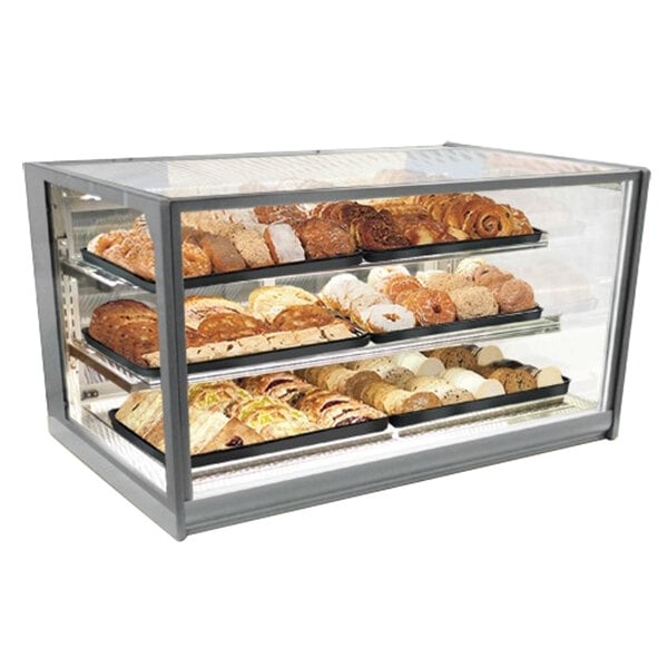 A Federal Industries Italian Series countertop display case with various types of bread in it.