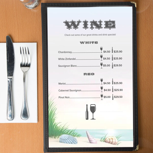 Menu insert with a seafood themed coral design on a table with wine glasses and a fork.