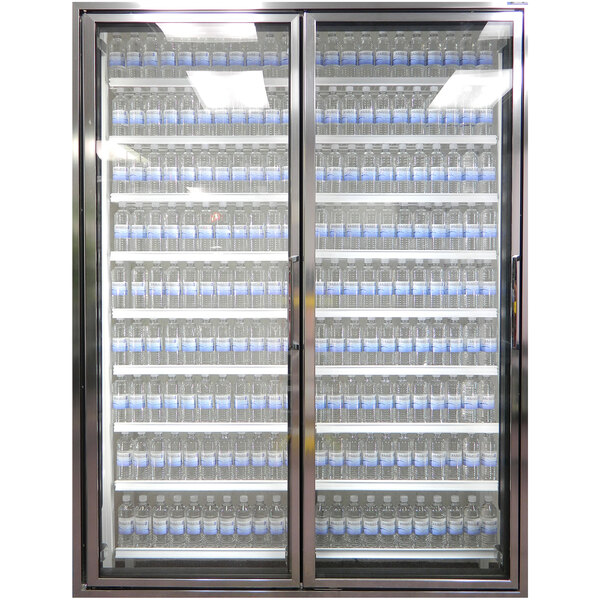 A Styleline walk-in cooler glass door with shelving holding water bottles.