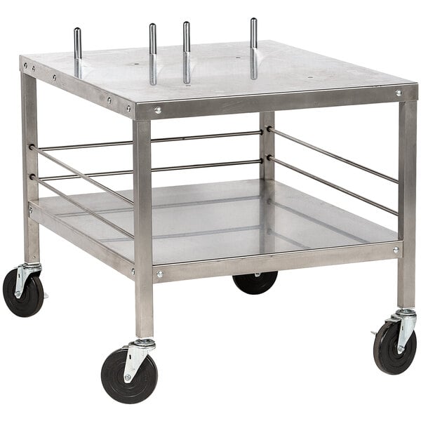 A metal mixer table with black wheels.