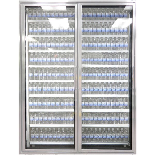 A Styleline walk-in cooler glass door with shelving filled with bottles of water.