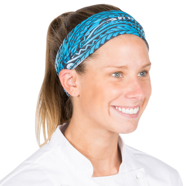 A woman wearing a blue Headsweats headband with a tribal print.