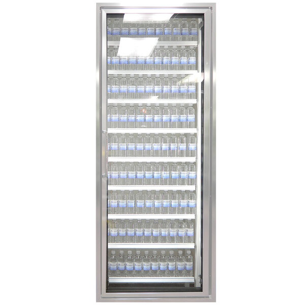 A Styleline walk-in cooler glass door with shelving holding water bottles.
