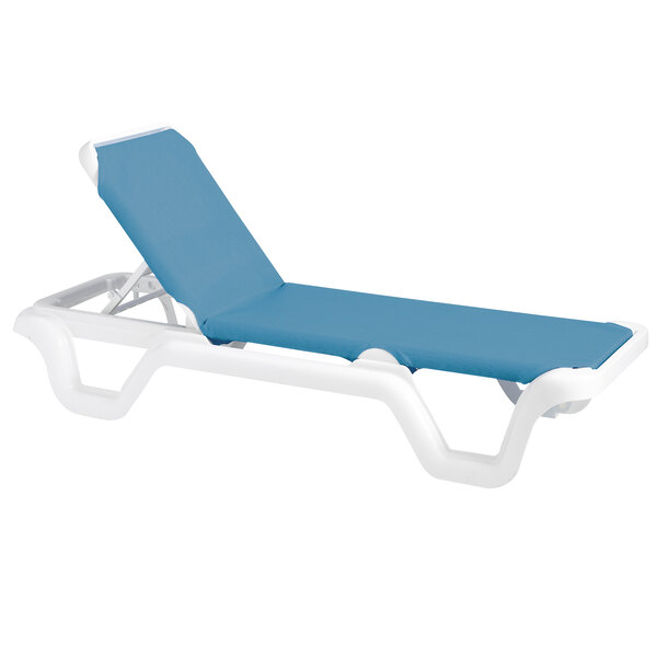 A white Grosfillex Marina sling chaise lounge chair with blue accents.