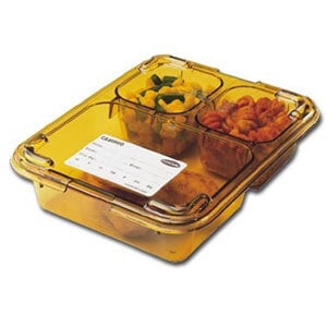 A yellow plastic container with food inside on a tray.