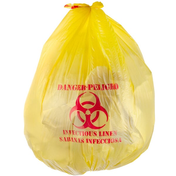 A yellow garbage bag with a red biohazard symbol.