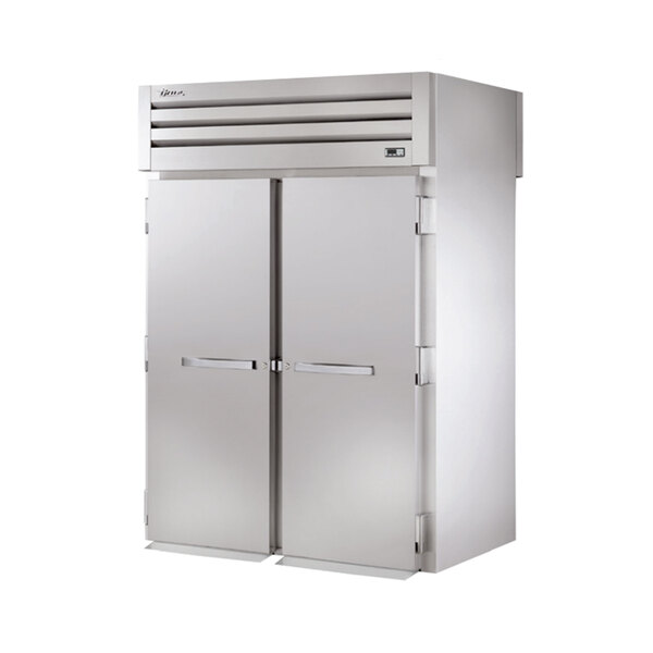 A large stainless steel True Spec Series roll-through refrigerator with two white doors.