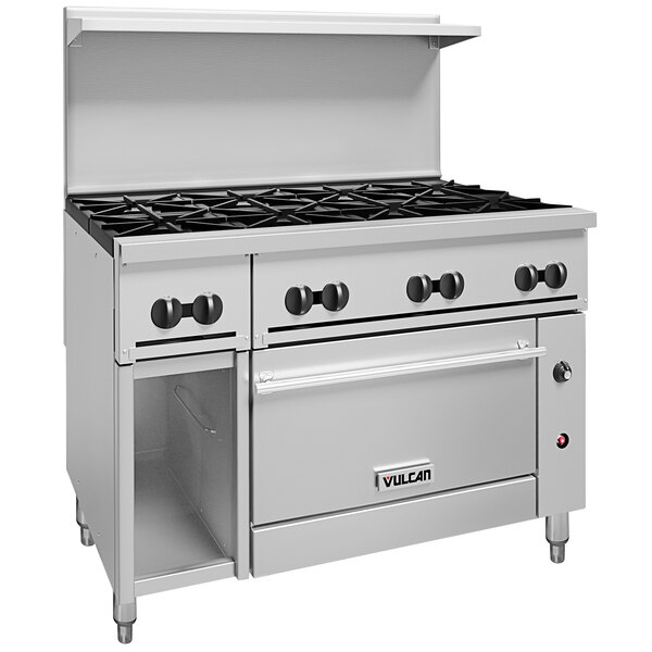 A white Vulcan commercial range with black knobs on open oven doors.