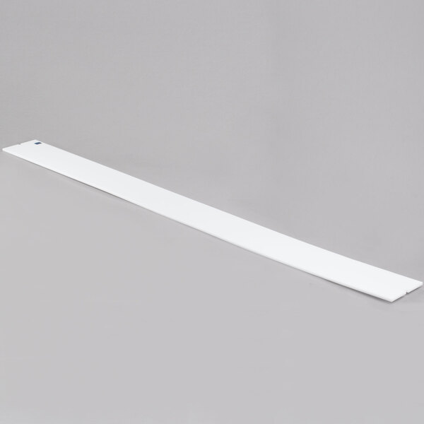 A long white rectangular Vollrath ServeWell cutting board.