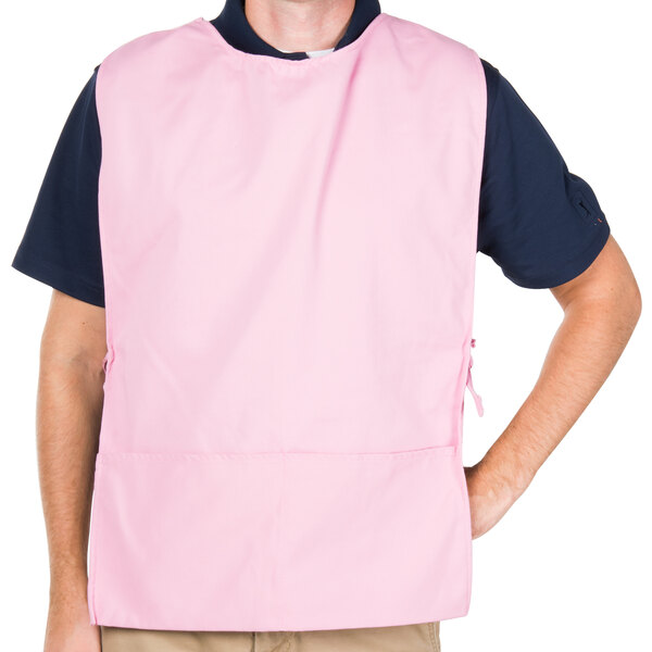 A man wearing a pink Intedge cobbler apron.