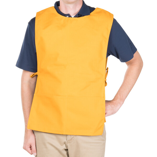 A man wearing a yellow Intedge cobbler apron.