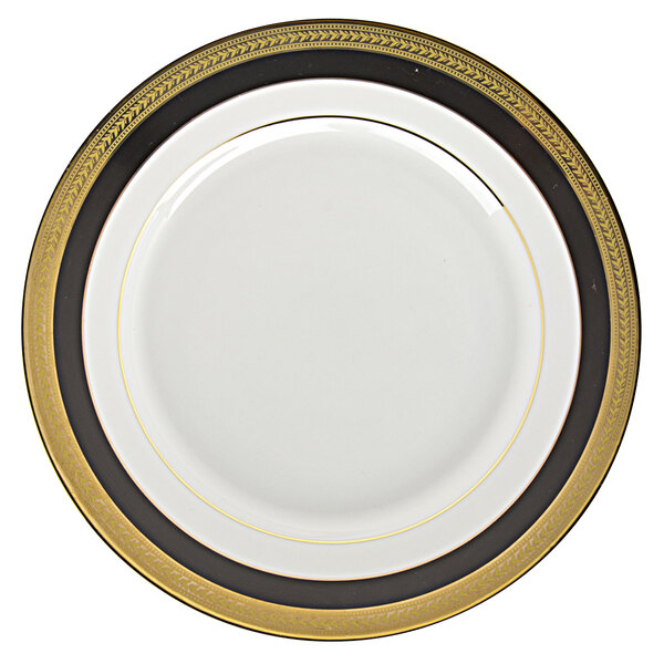 A white porcelain bread and butter plate with black and gold trim.