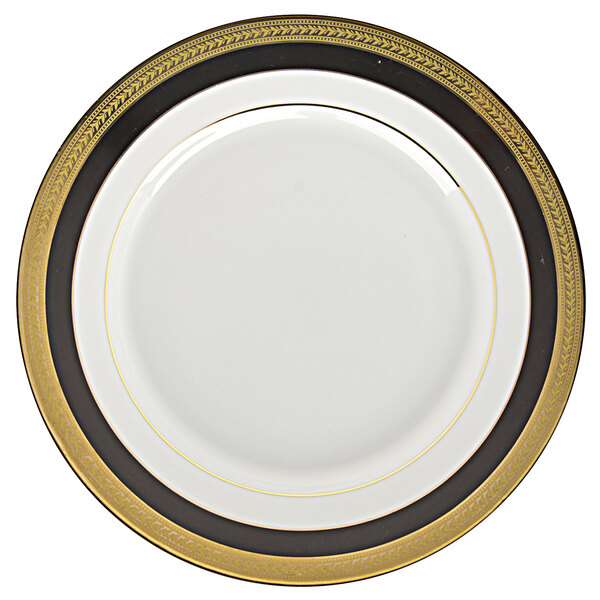 A white porcelain plate with a black and gold rim.